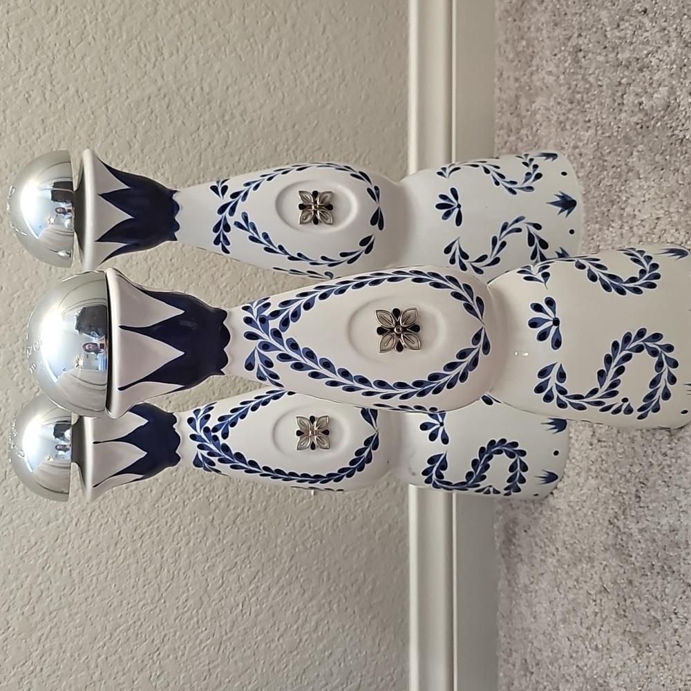 3 Empty Clase Azul tequila Reposado bottle.